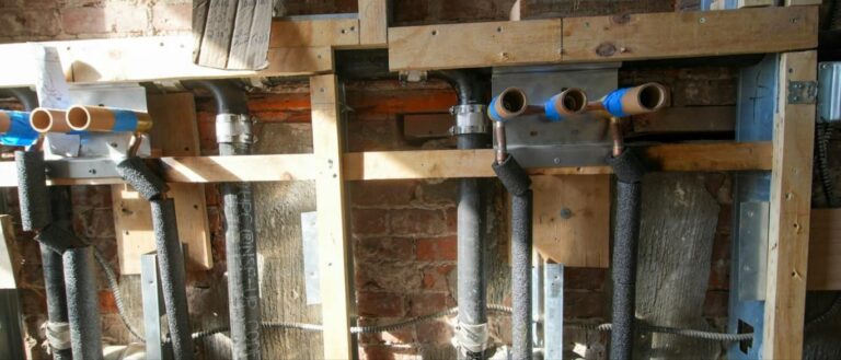 Plumbing rough-in pipes in an open wall