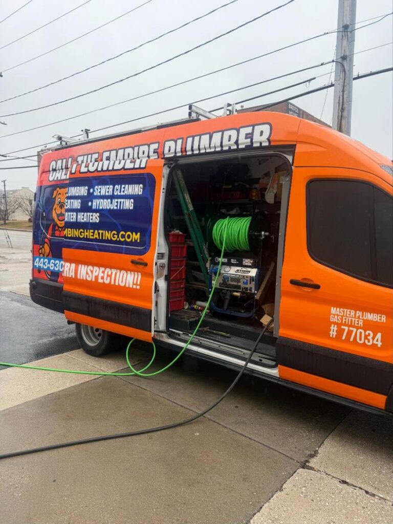 Empire van with hydrojetter hoses running to a drain