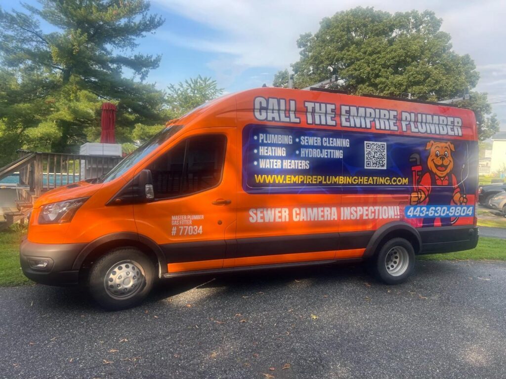 Orange Empire Plumbing van with sewer camera inspection lettering